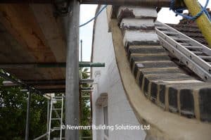 Repairs to bricks and mortar above gable