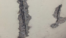 picture showing spalled concrete and corroded rebar