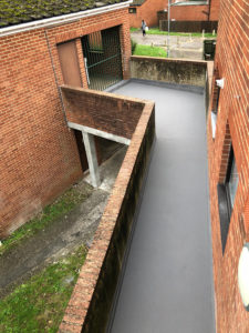 Aerial view of external walkway coated in Polyac Rapid, anti-slip, waterproof, decorative, concrete coating system.